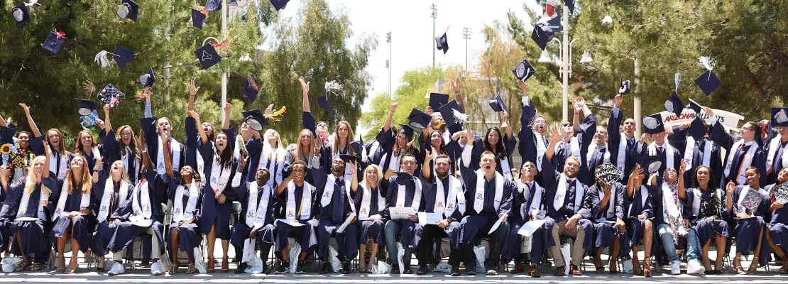 Graduates tossing their caps in the air